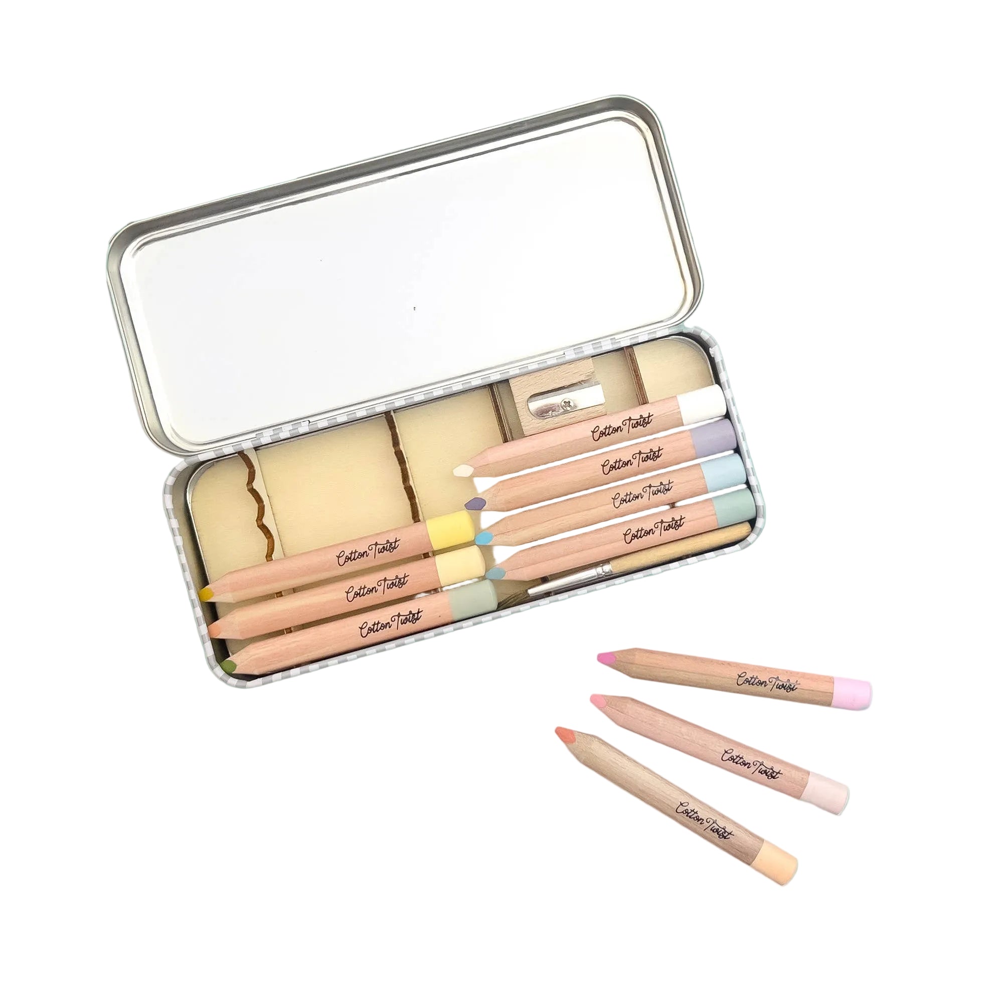 Set of makeup pencils in a metal case on a teal background