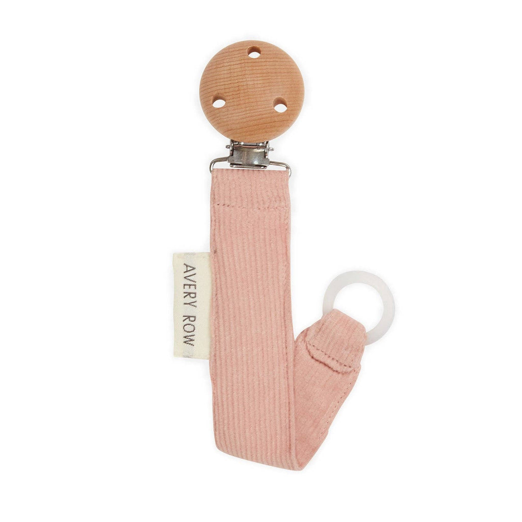 Pink baby pacifier clip with wooden top on a white background, featuring 'Avery Row' brand.