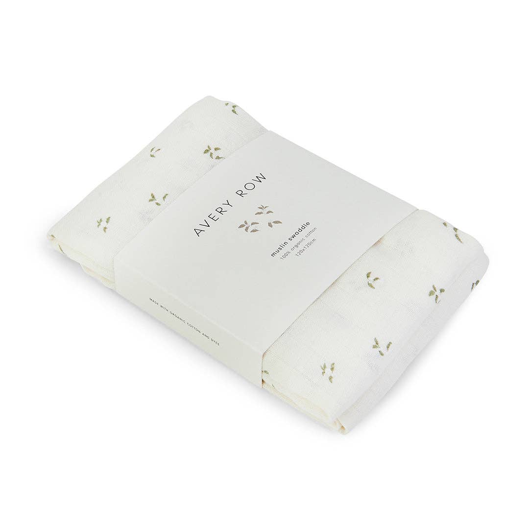 Folded baby muslin swaddle with 'Avery Row' branding on a white background