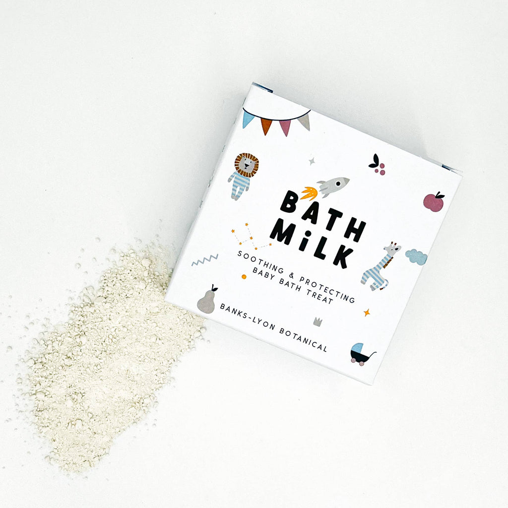Bath milk packaging with white powder on a light background