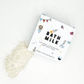 Bath milk packaging with white powder on a light background