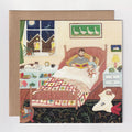 Illustrated card of a child reading to a teddy bear in bed with a nightlight.
