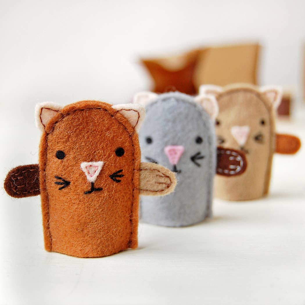 Three felt cat finger puppets on a white background