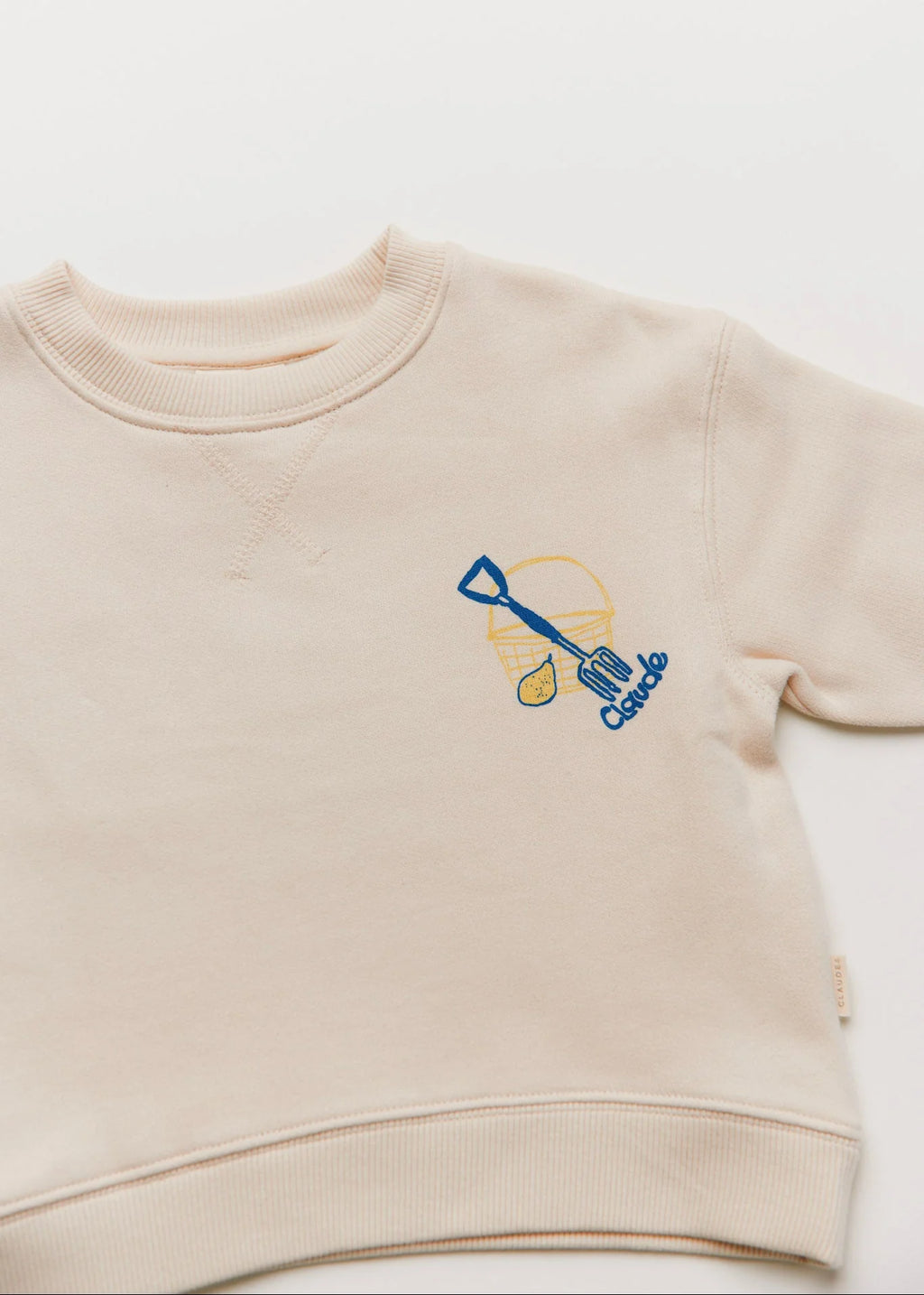 Beige sweatshirt with a blue and yellow design on a white background
