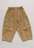 Ochre checkered pants on a light gray background