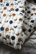 Quilt with moon and pattern on a soft surface