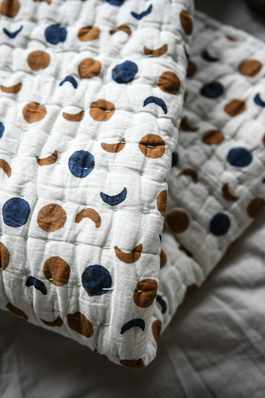 Quilt with moon and pattern on a soft surface