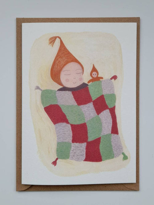 Illustration of a child with a checkered blanket and small figure on a greeting card.
