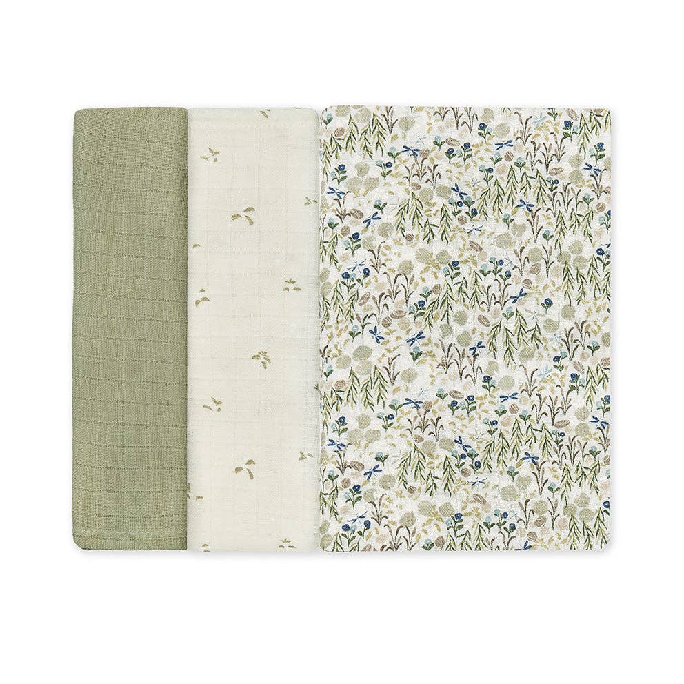 Three muslin square with different patterns on a white background