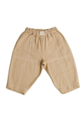 Beige baby pants on a white background