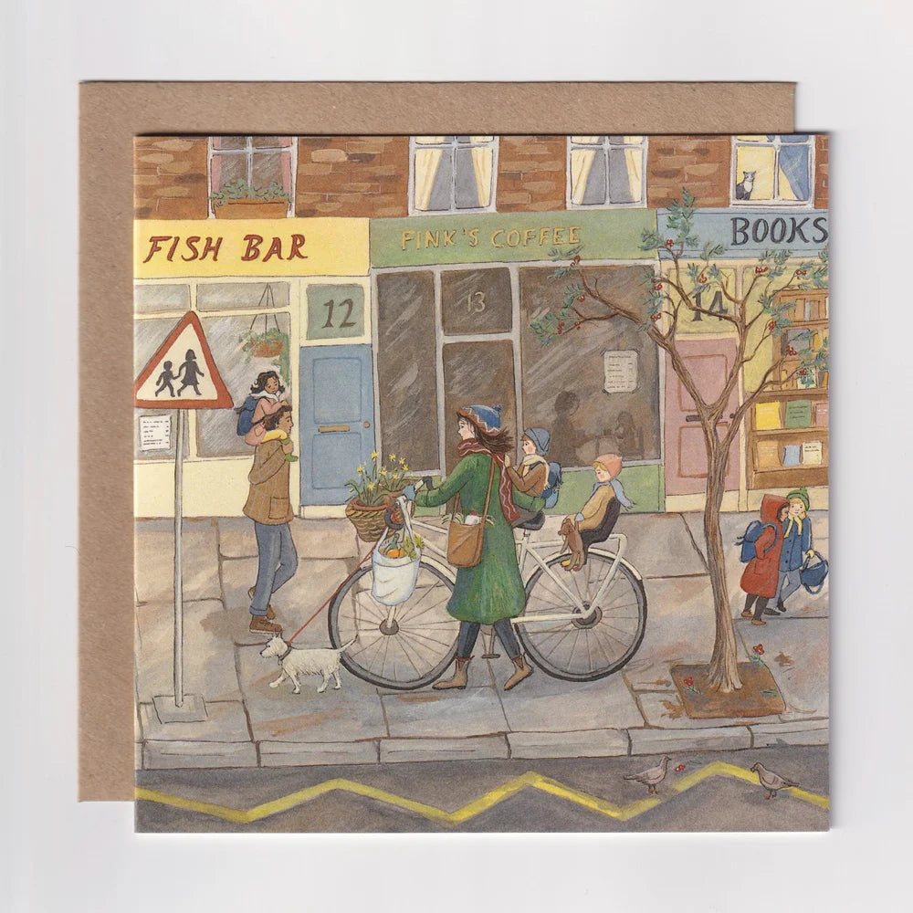 Illustrated card with a street scene featuring people and shops.