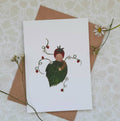 Card with a leaf-themed illustration of a child on a textured surface with flowers.
