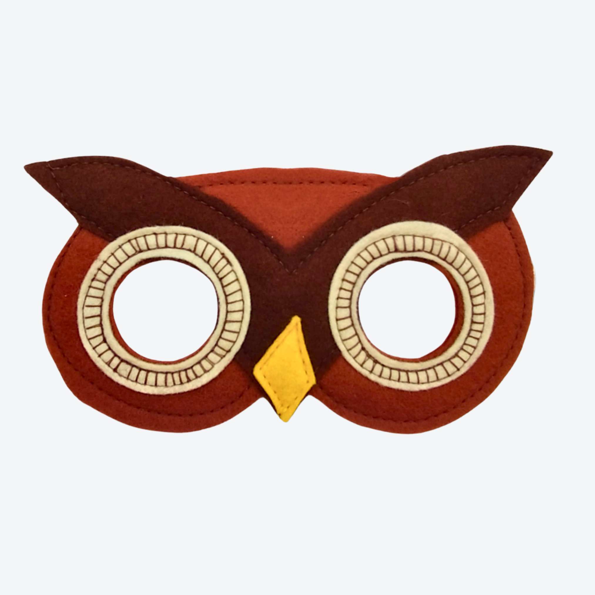 Owl-shaped mask with brown and yellow colors on a white background